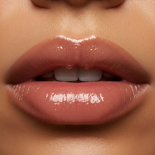 Close-up of a person's lips with a glossy lip product